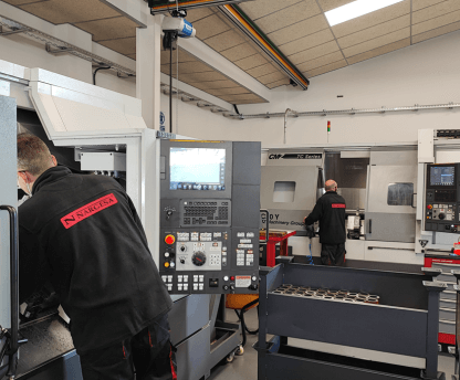 Two operators from Nargesa working in the Machining Centers